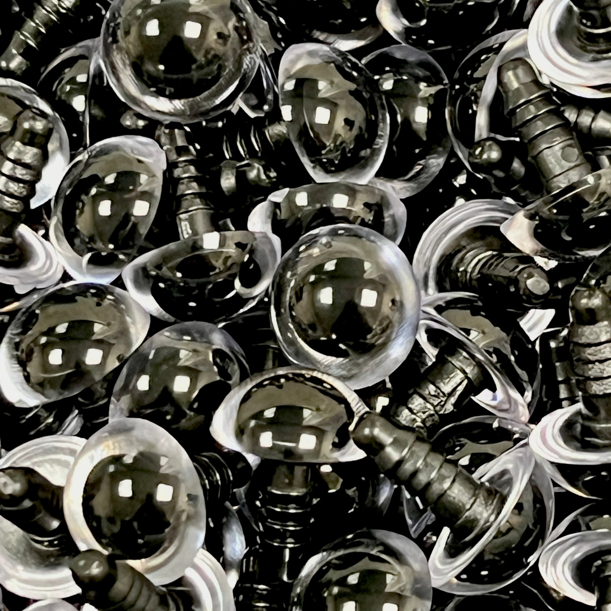 A collection of 14mm clear safety eyes for toys, displayed in rows, with visible metal fixtures.